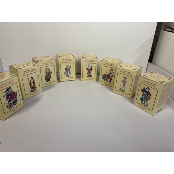 Santa Figurines (8 total) - The International Santa Claus Collection - Saint Lucia,   Includes Santa