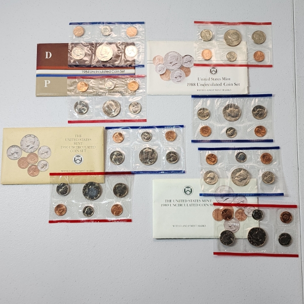 Four United States Mint Uncirculated Coin Sets: 1984, 1988, 1989, 1990