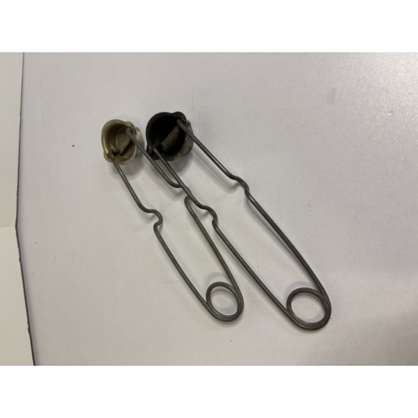 Vintage cup-style flint strikers used for lighting gas welding torches or bunsen burners 