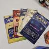 Image 3 : Disney Lorcana Lot With Deck Case, Sleeves, Cards, Token Trackers, Rulebooks, And Tote Bag