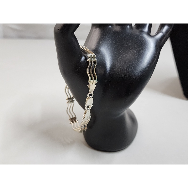 Sterling Silver 7in Wave Link Bracelet TW: 12.3g