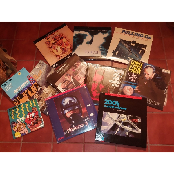 Large Group Of vintage Movie Bolockbuster Video Disks In Original Sleeves & Holders - See Pics