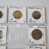 Image 9 : Two Binder Pages Filled with Assorted World Coins: Switzerland, France, Sweden, Italy, & More!
