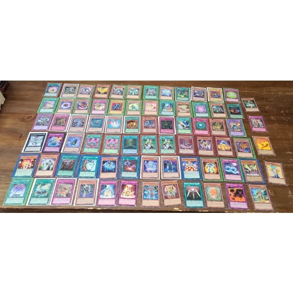 Assorted Yu-Gi-Oh Cards In Sleeves Including Some Holos