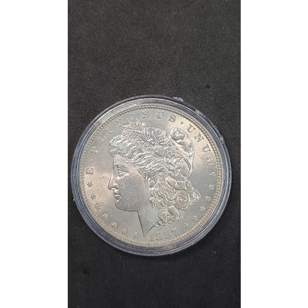 United States 1887 Morgan 90% Silver Dollar In Coin Capsule