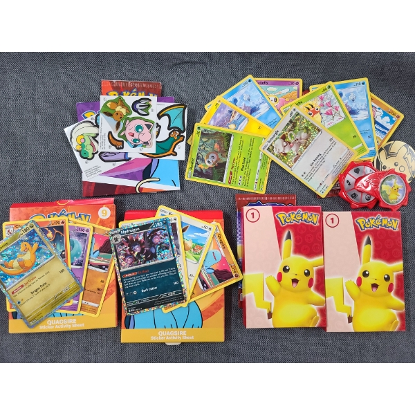 Lot of Four McDonalds Pokemon Sets Including Trading Cards, Stickers, Activity Sheets & More