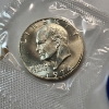 Image 2 : United States Mint 1974 40% Silver Uncirculated Eisenhower Dollar in Original Blue Packaging