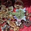 Image 3 : Various Vintage Costume Jewelry Brooches and Pins, featuring Floral Designs and Gold-Tone Finishes