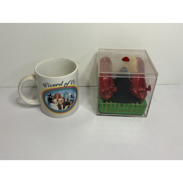 Themed collectible set featuring miniature replicas of the ruby slippers, a witch's hat, and a broom