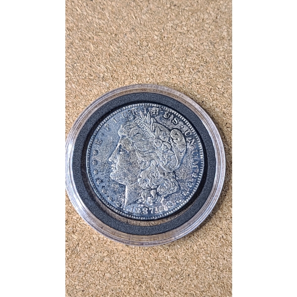 1887 90% Silver Morgan Dollar In Coin Capsule