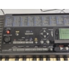 Image 2 : Yamaha PSR-320 61-Key MIDI Keyboard featuring a Black Chassis and a Multi-Function LCD Display