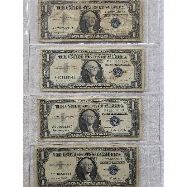 Four US Treasury Blue-Seal Silver Dollar Notes in Protective Binder Page - AFV $4