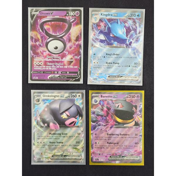 Four Assorted Holo Rare Pokemon Trading Cards Including Kingdra & Unown