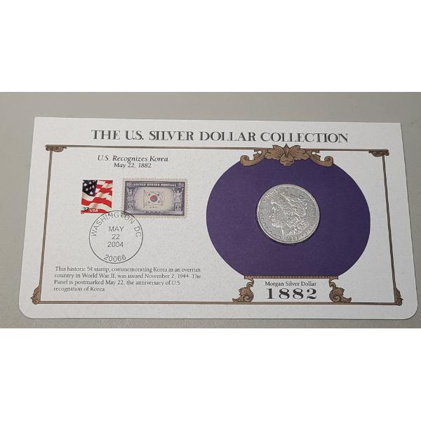 The U.S Silver Dollar Collection 1882 Morgan Silver Dollar Including Commemorative Stamps 