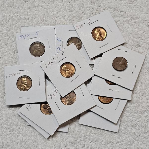 Assortment of BU Proof-Like, Wheat, and Copper Pennies in Protective Casings FV: $.42