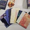 Image 7 : Disney Lorcana Lot With Deck Case, Sleeves, Cards, Token Trackers, Rulebooks, And Tote Bag