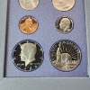 Image 4 : 1986 U.S. Liberty 7-Coin Prestige Set Including 90% Silver Liberty Dollar - OGP Packaging & CoA