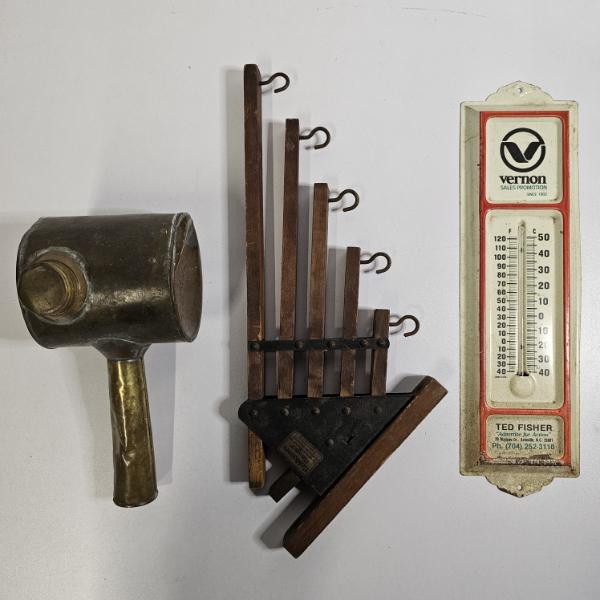 Three Vintage Collectibles Including Brass Sprinkler, Folding Hanger, and Advertising Thermometer