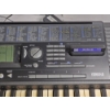 Image 3 : Yamaha PSR-320 61-Key MIDI Keyboard featuring a Black Chassis and a Multi-Function LCD Display