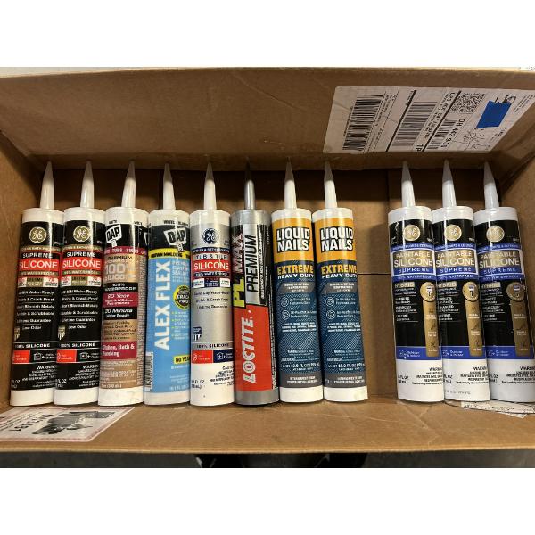 Box of Unused Caulk and Liquid Nails