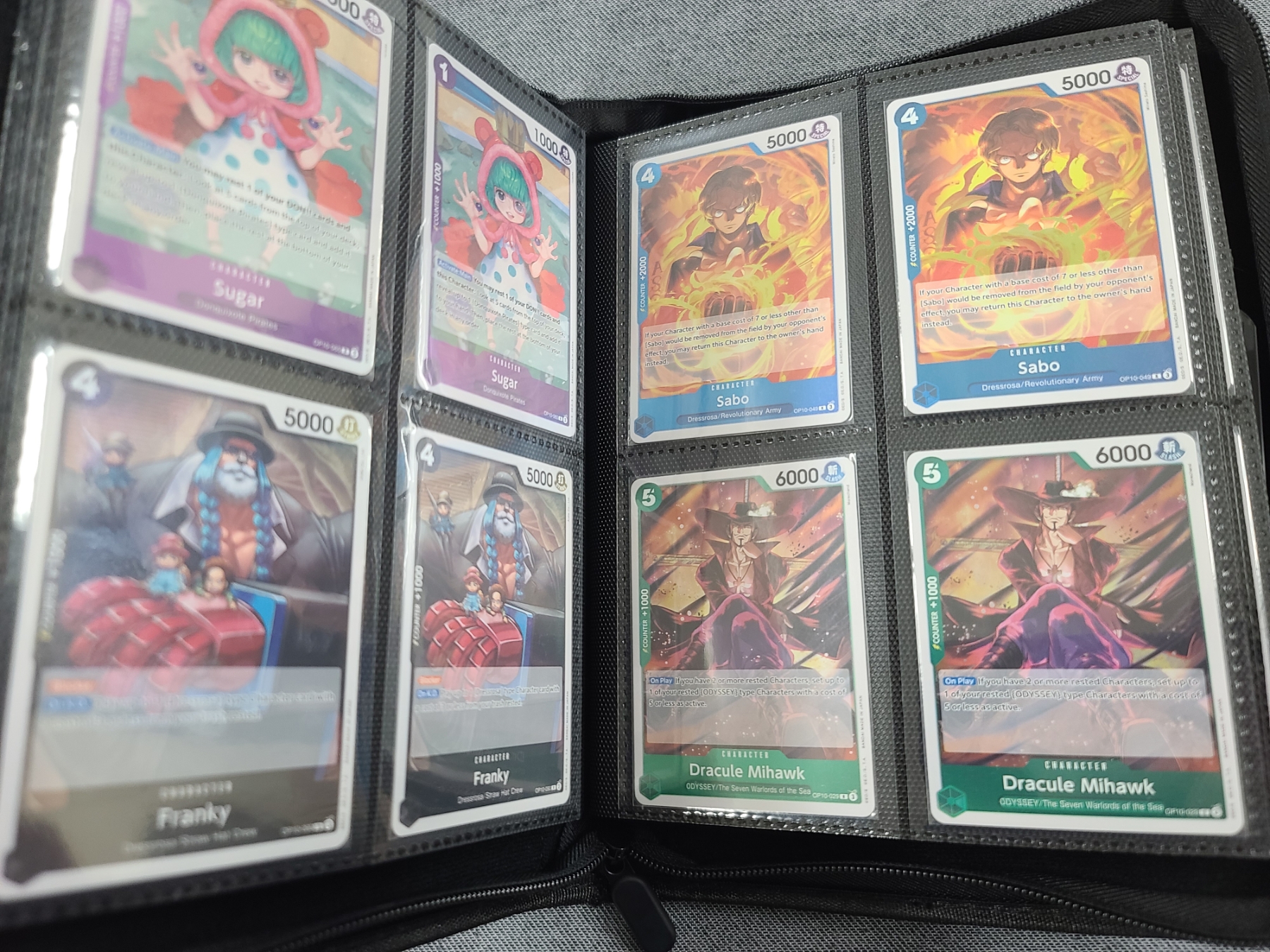 Binder Loaded With Assorted One Piece Trading Cards - 4 Card Per Page Binder - Holds Over 150 Cards - Bosley Auctioneers Binder Loaded With Assorted One Piece Trading Cards - 4 Card Per Page Binder - Holds Over 150 Cards - Bosley Auctioneers