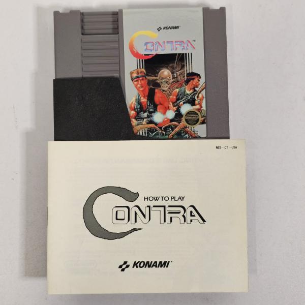 NES Contra Video Game Cartridge With Instruction Manual And Black Dust Sleeve