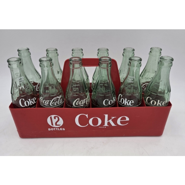 Great Condition 12 Coke Bottles And Plastic Carrier