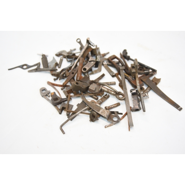 Over 60 older double shotgun parts ejectors linkage firing pius and misc parts