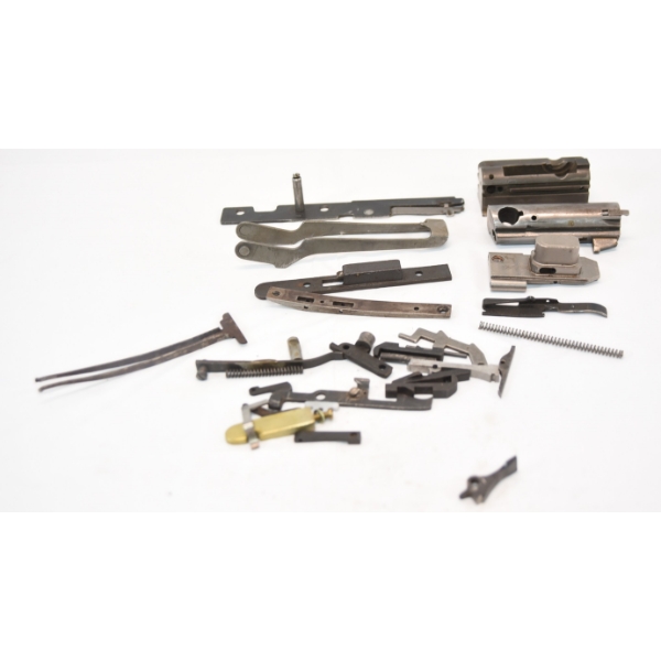 Group Of Over 30 Shotgun Semi Auto Bolts Carriers And Small Parts