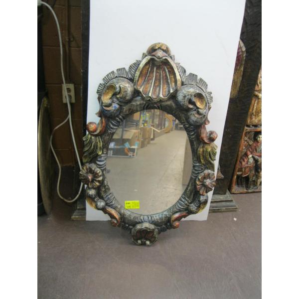 HEAVILY CARVED OVAL MIRROR