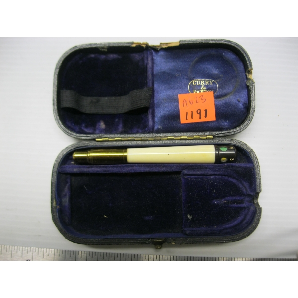 VINTAGE CASE W/SOME KIND OF TOOL??