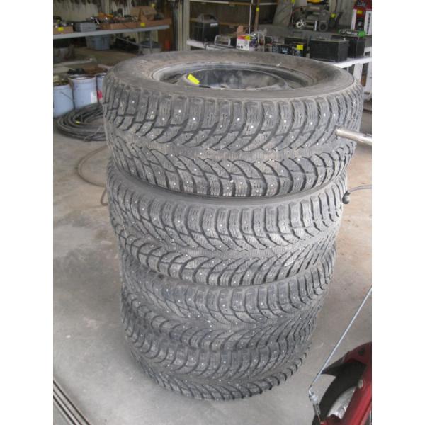 SET OF 4 STUDDED NOKIAN TIRES -  275-65R18 - GOOD TREAD ON RIMS