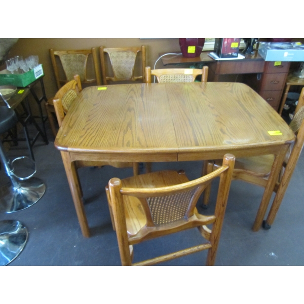 OAK TABLE W/4 CHAIRS ON CASTORS