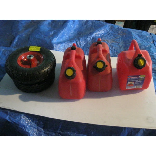 2 NEW TIRES & 3 FUEL CANS