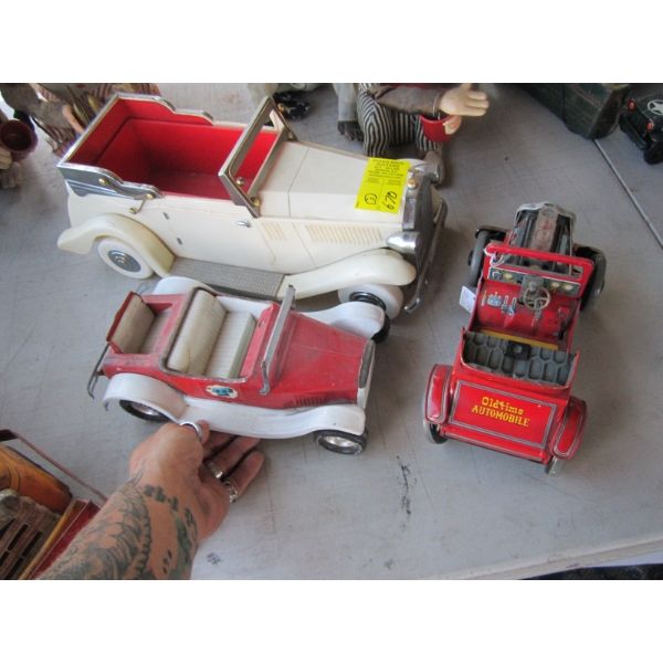 3 CARS - 1 PLASTIC, 2 METAL - 1 IS A MUSIC BOX