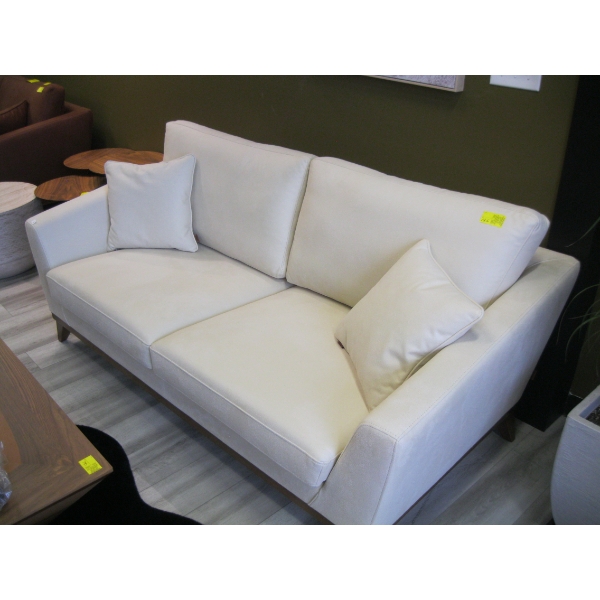 LIGHT COLORED SOFA W/CUSHIONS