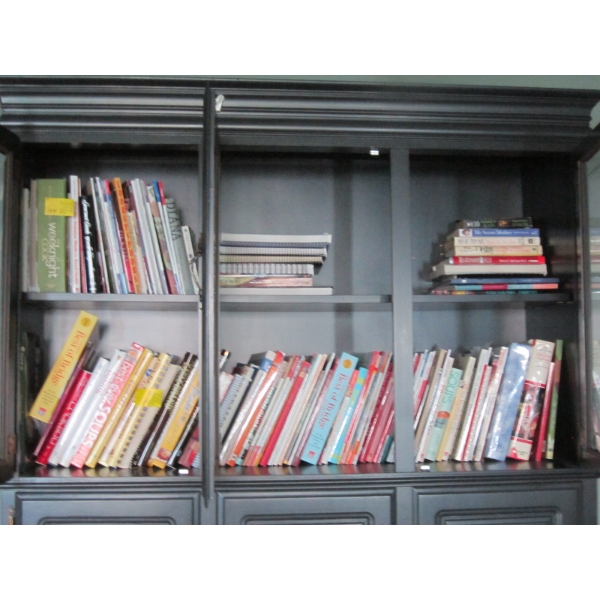 LG. LOT OF BOOKS IN CABINET