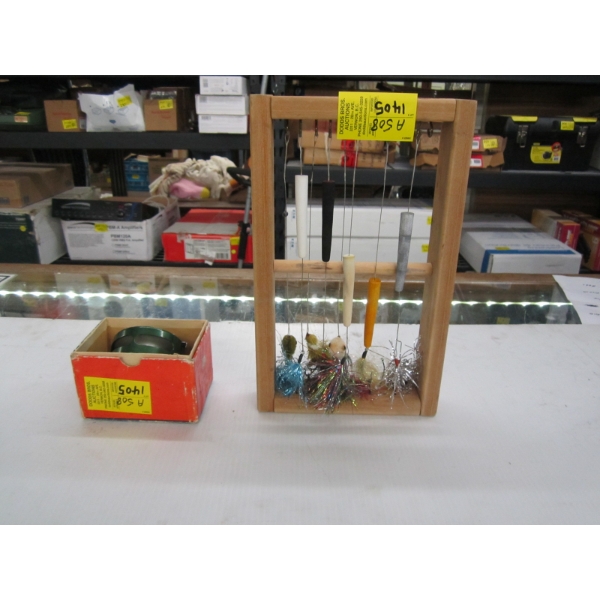 FISHING LINE HOLDER W/VARIOUS HOOKS & BOBBERS & A SHAKESPEARE REEL