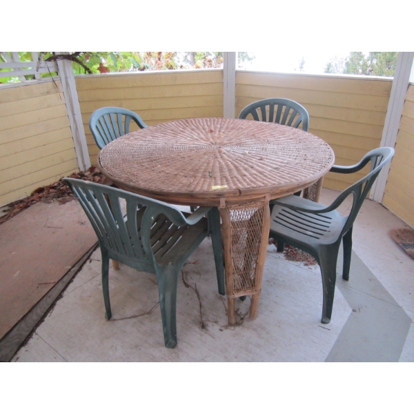 ROUND RATTAN TABLE & 4 GREEN PLASTIC CHAIRS