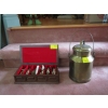 Image 1 : SM. BRASS LIDDED MILK CAN & LIQUOR FILLED FIGURINES IN CASE (EMPTY)