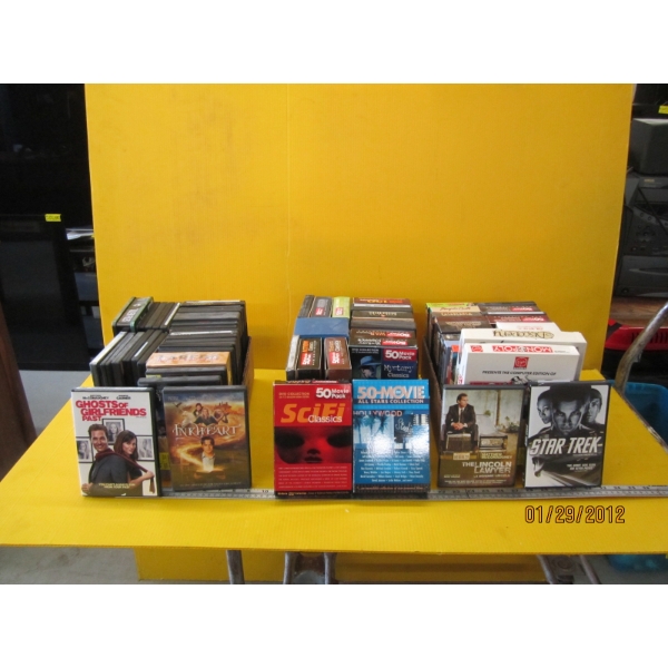 3 BOXES OF DVDs
