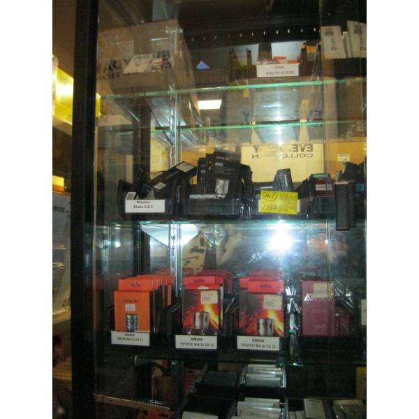 LG. LOT OF VAPE STORE ITEMS - 4 SHOWCASES FULL