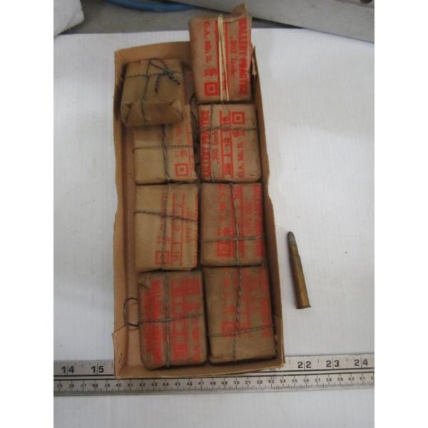 8 PACKAGES OF .303 CARTRIDGES WRAPPED IN PAPER