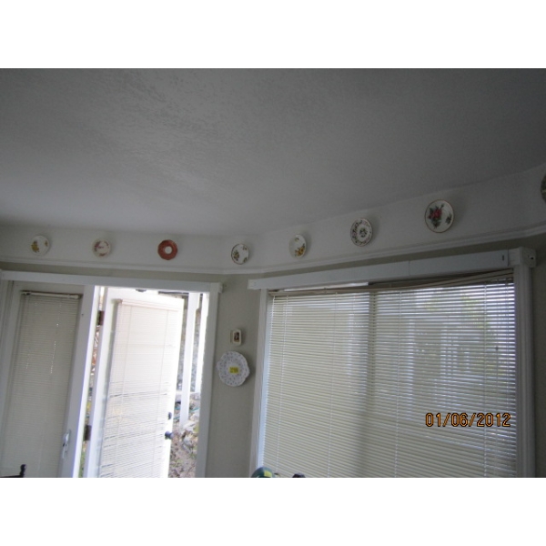 LG. LOT OF COLLECTABLE PLATES HANGING ON WALL