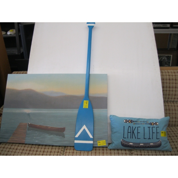 FRAMED PRINT OF CANOE, PADDLE & PILLOW