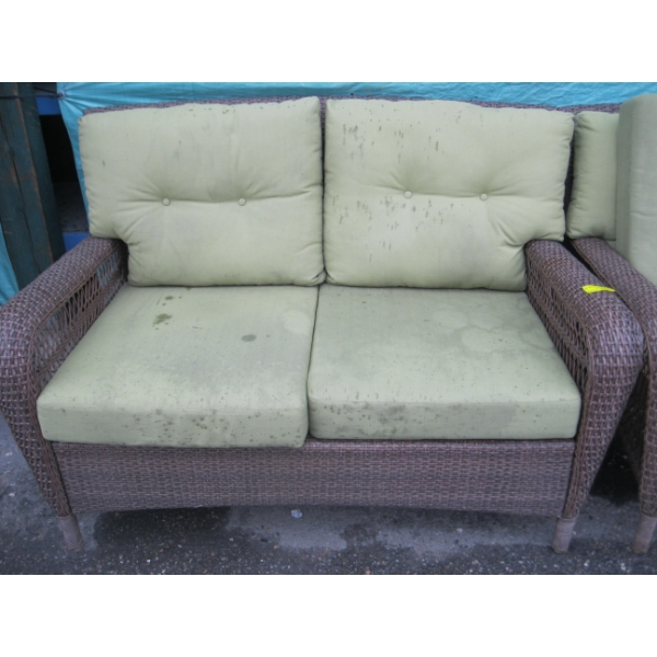 BROWN PLASTIC WICKER LOOK LOVESEAT W/GREEN CUSHIONS
