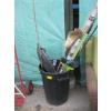 Image 1 : BLACK GARBAGE CAN W/MISC. GARDEN TOOLS, DÉCOR, BAMBOO STAKES, ETC.