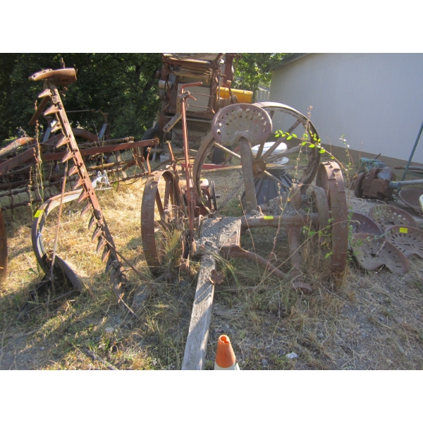 YARD ART W/PULL BEHIND HAY CUTTER & OLD WOODEN WAGON WHEEL