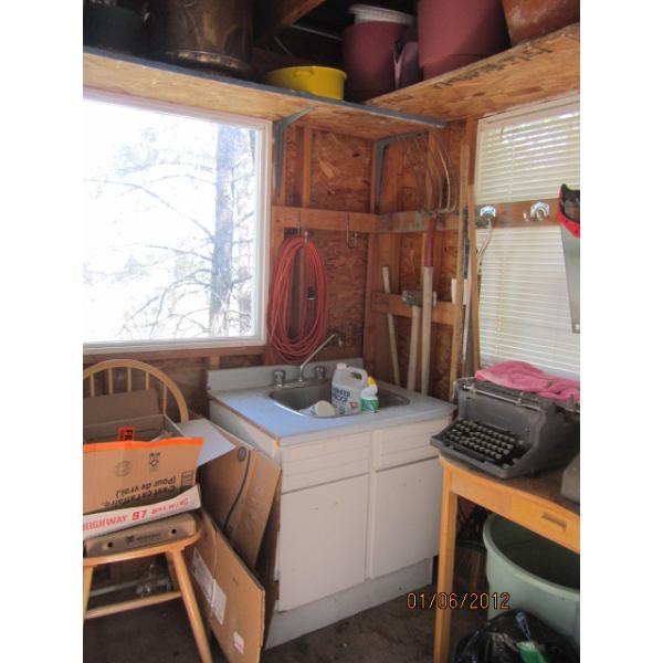 EVERYTHING INSIDE SM. BUILDING - POTS, SINK UNIT, DESK, TYPEWRITER, GARDEN TOOLS, SIGN, ETC.