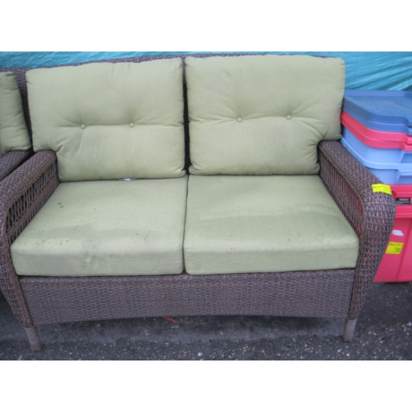 BROWN PLASTIC WICKER LOOK LOVESEAT W/GREEN CUSHIONS